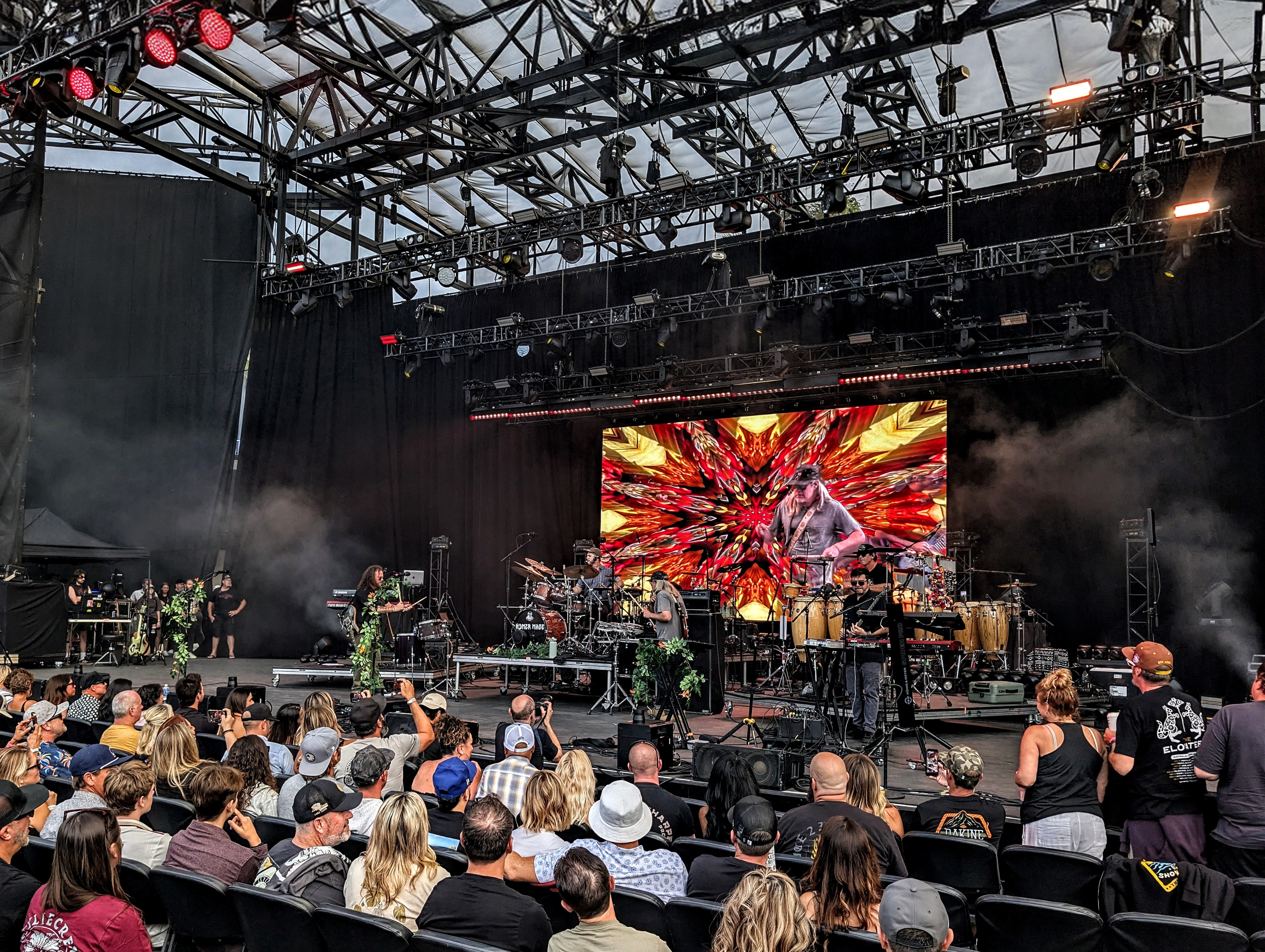The Hip Abduction performing as kaleidoscope visuals fill the stage screen