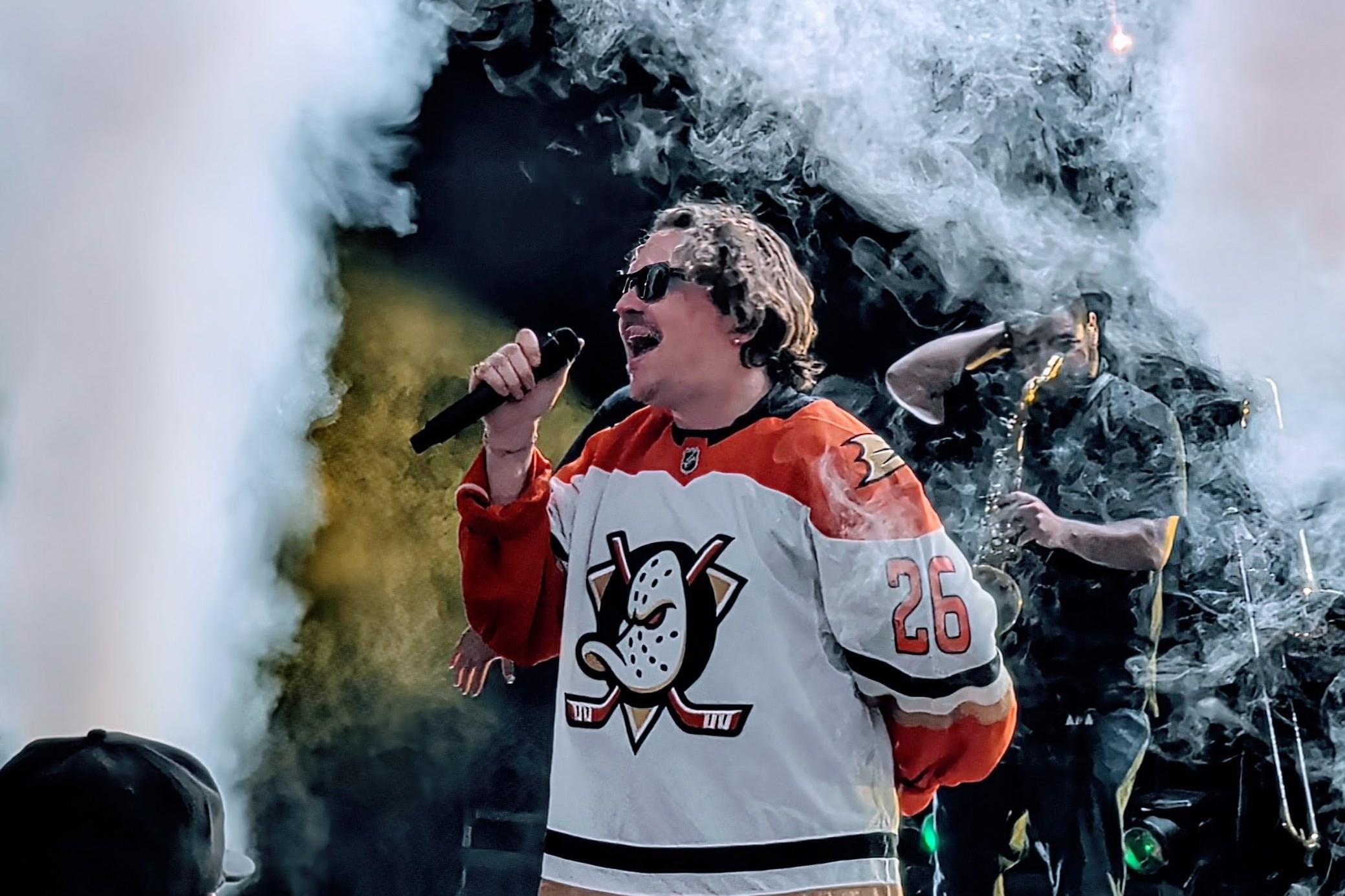 Jackson Wetherbee singing as smoke surrounds him onstage