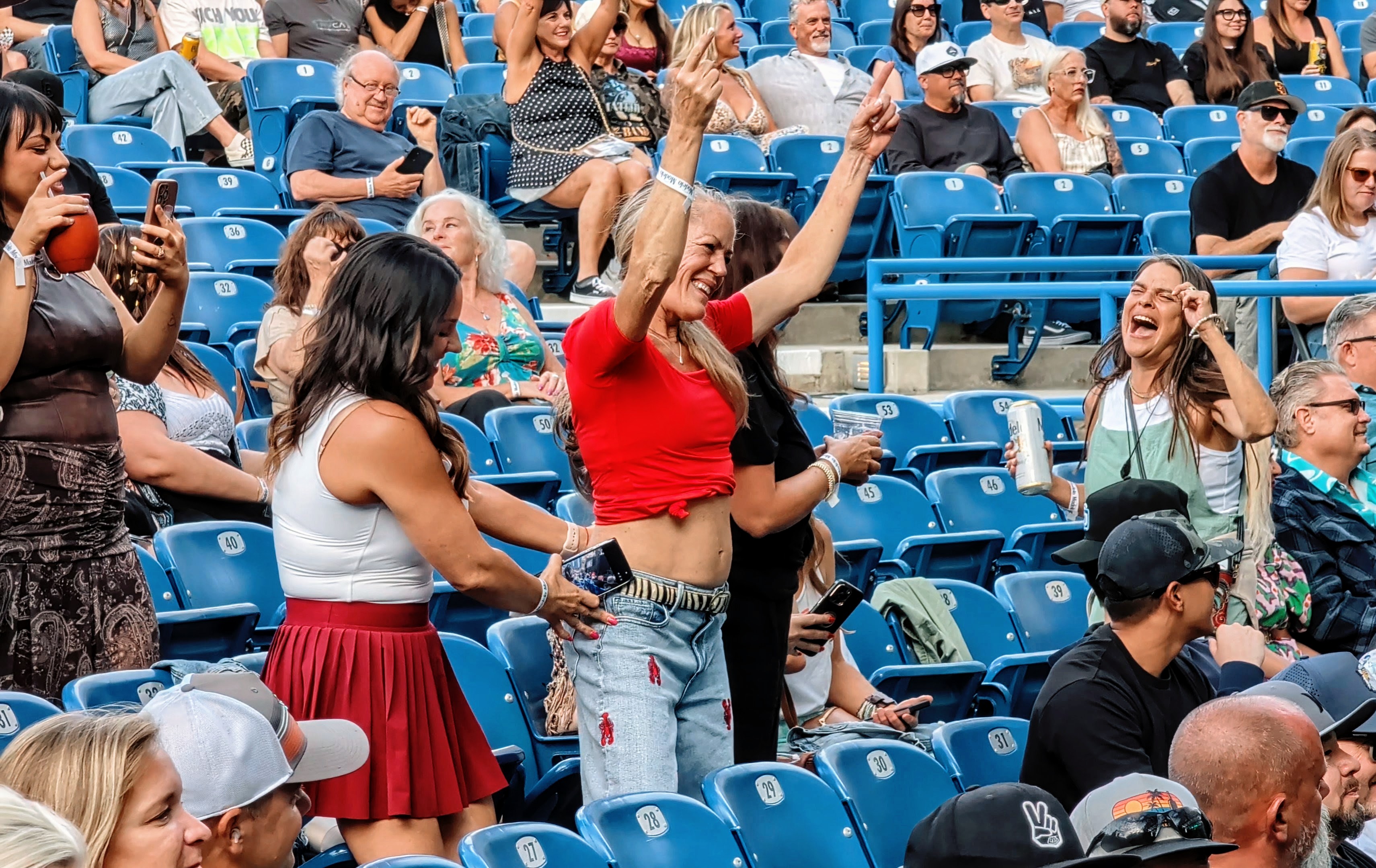 Lisa dancing during Afroman's performance as her friends cheer her on